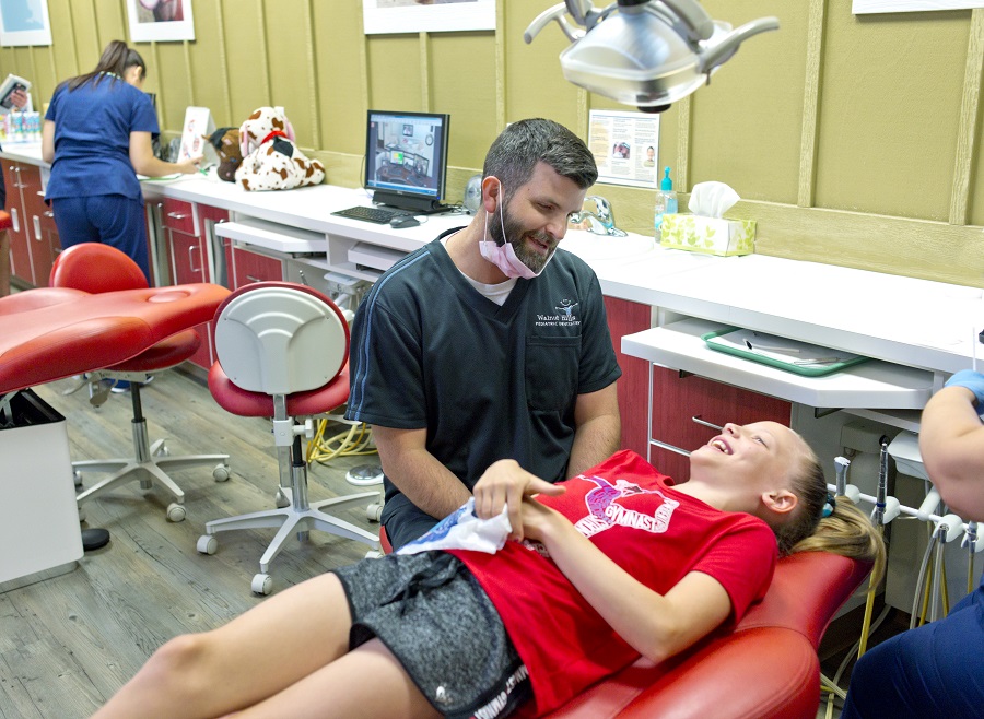 Dentist making kid laugh