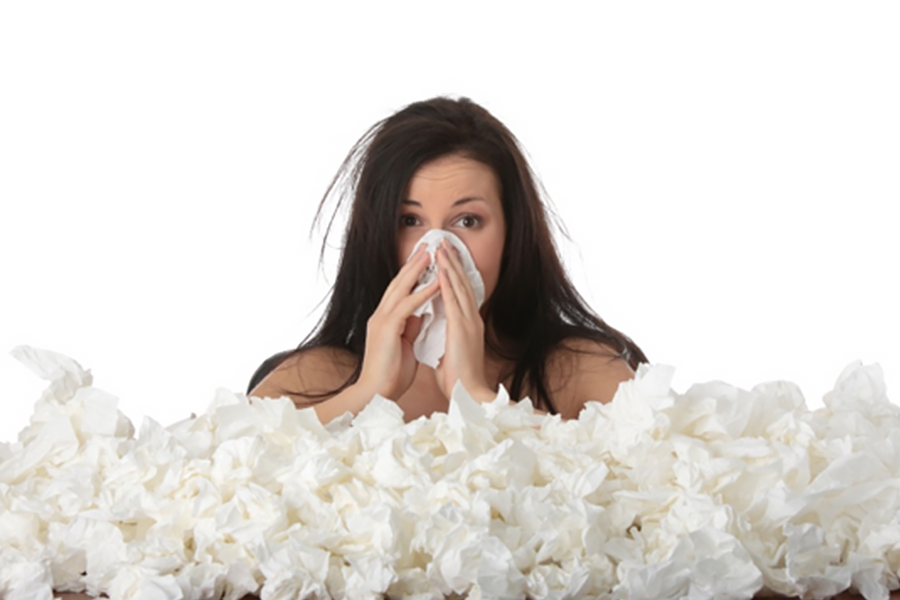 A woman with allergies and sinus pressure blows her nose dozens of times.